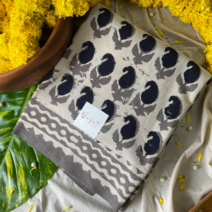 Half white mul mul saree with blue handprinted patterns